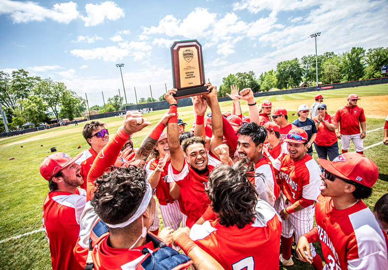 The Patriots baseball team celebrates winning the opening round of the MSC tournament.
