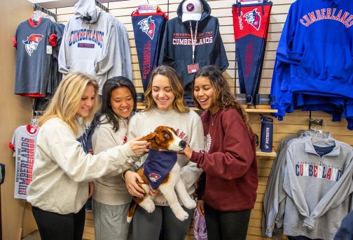 Students check out a stuffed puppy at the campus bookstore. 