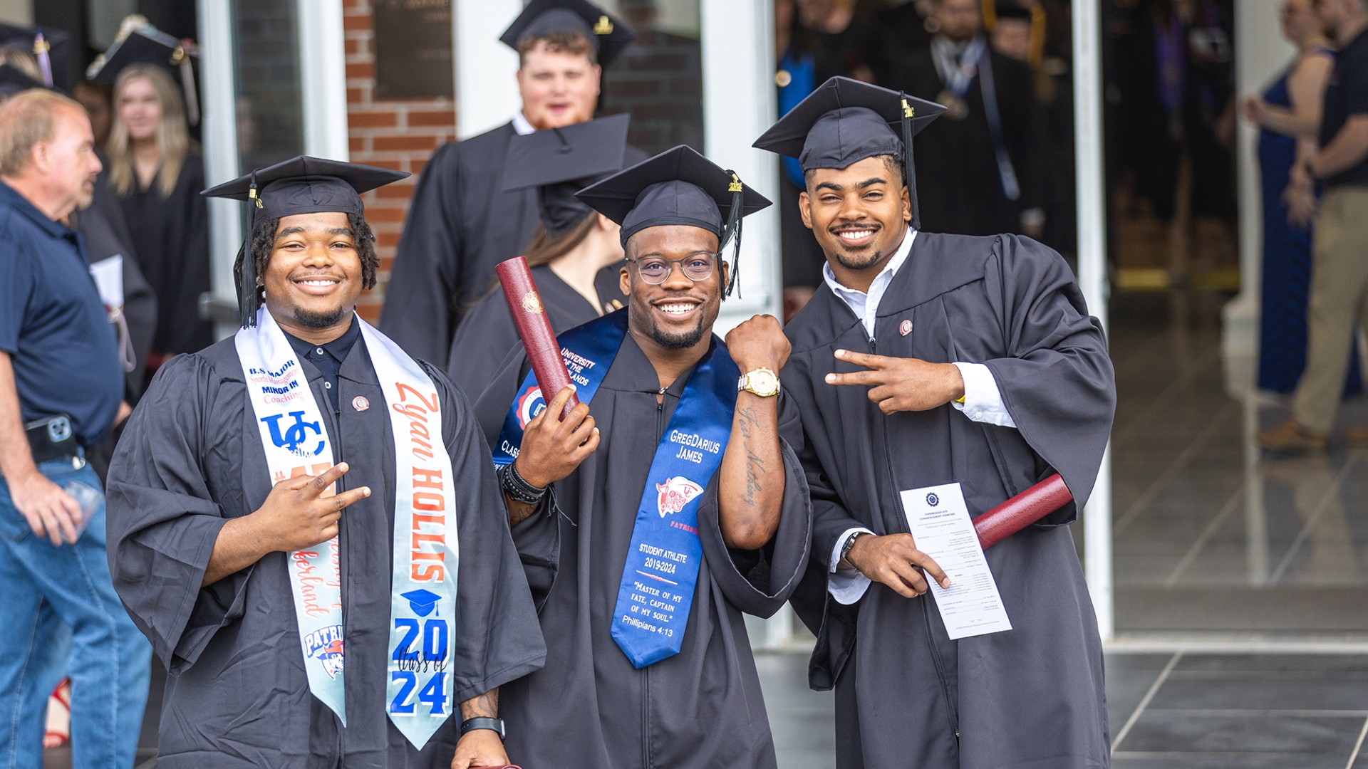 Three students celebrate their graduation at University of the Cumberlands.