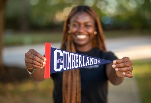 A Cumberlands student shows off the school's pennant 