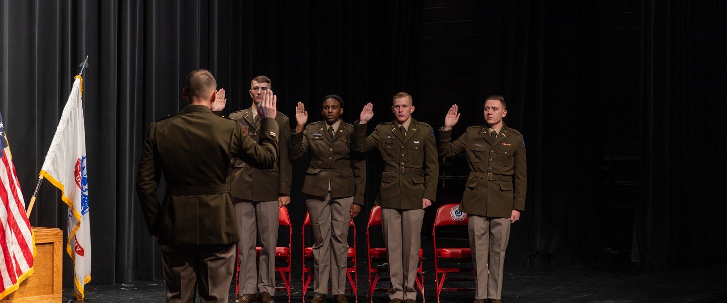 ROTC cadets in the class of 2024 take the Oath of Office commissioning them as 2nd lieutenants in the U.S. Army.