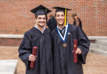 Students display their diplomas following Cumberlands graduation. 